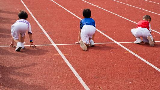 children stretching at a track